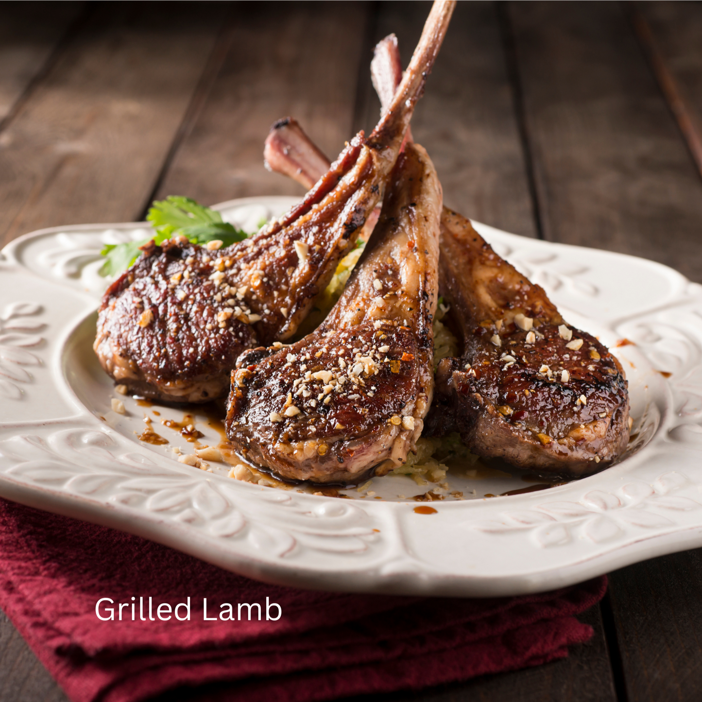 Grilled, Seasoned Lamb Chops on White Plate.